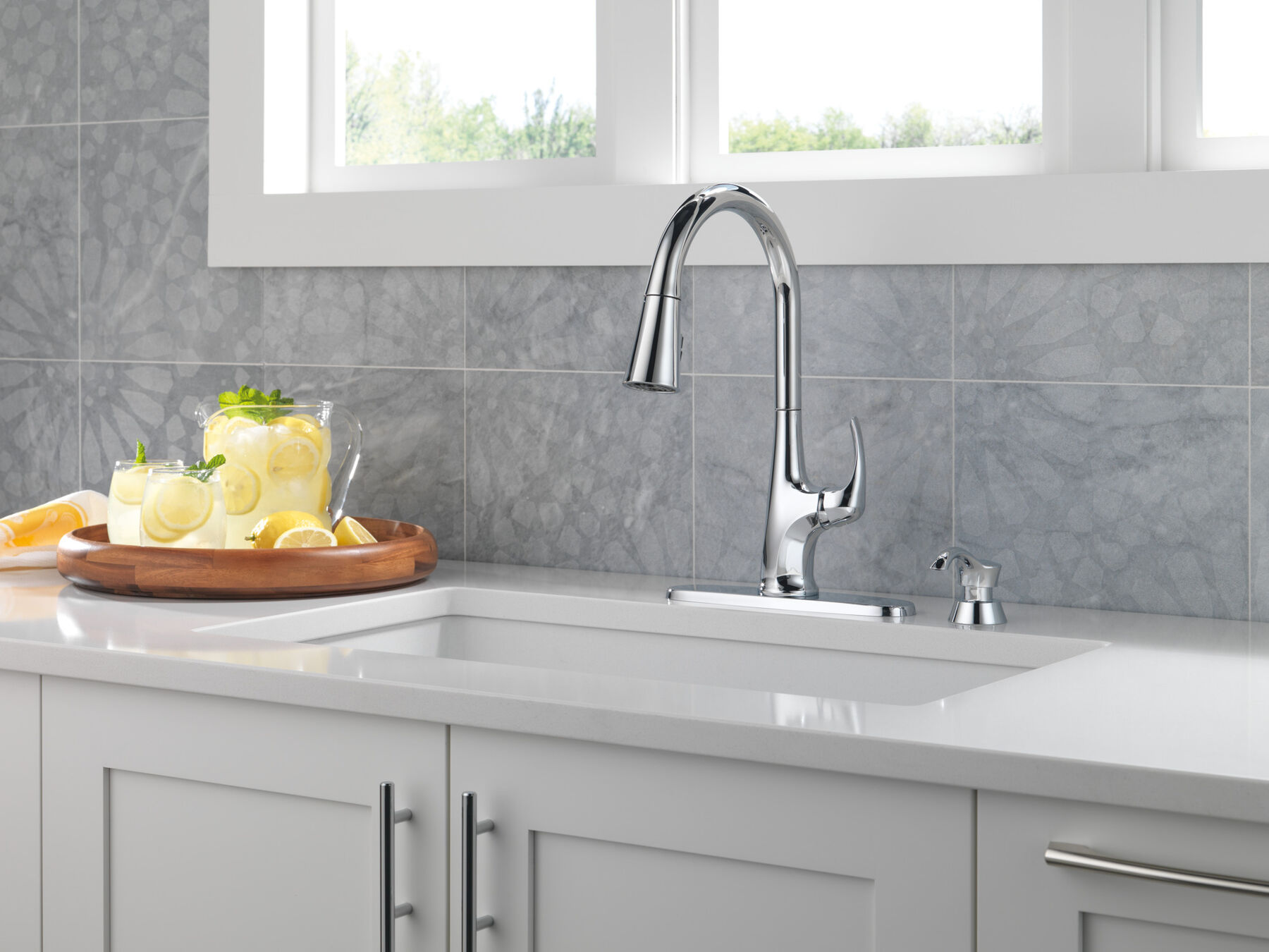 Single Handle Pull-Down Kitchen Faucet with Soap Dispenser and ShieldSpray Technology in Chrome — image 1